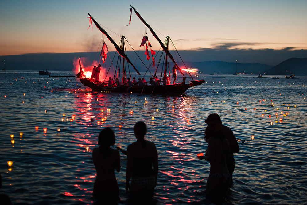 Ancient sailing ship at sea in the Stella Maris night