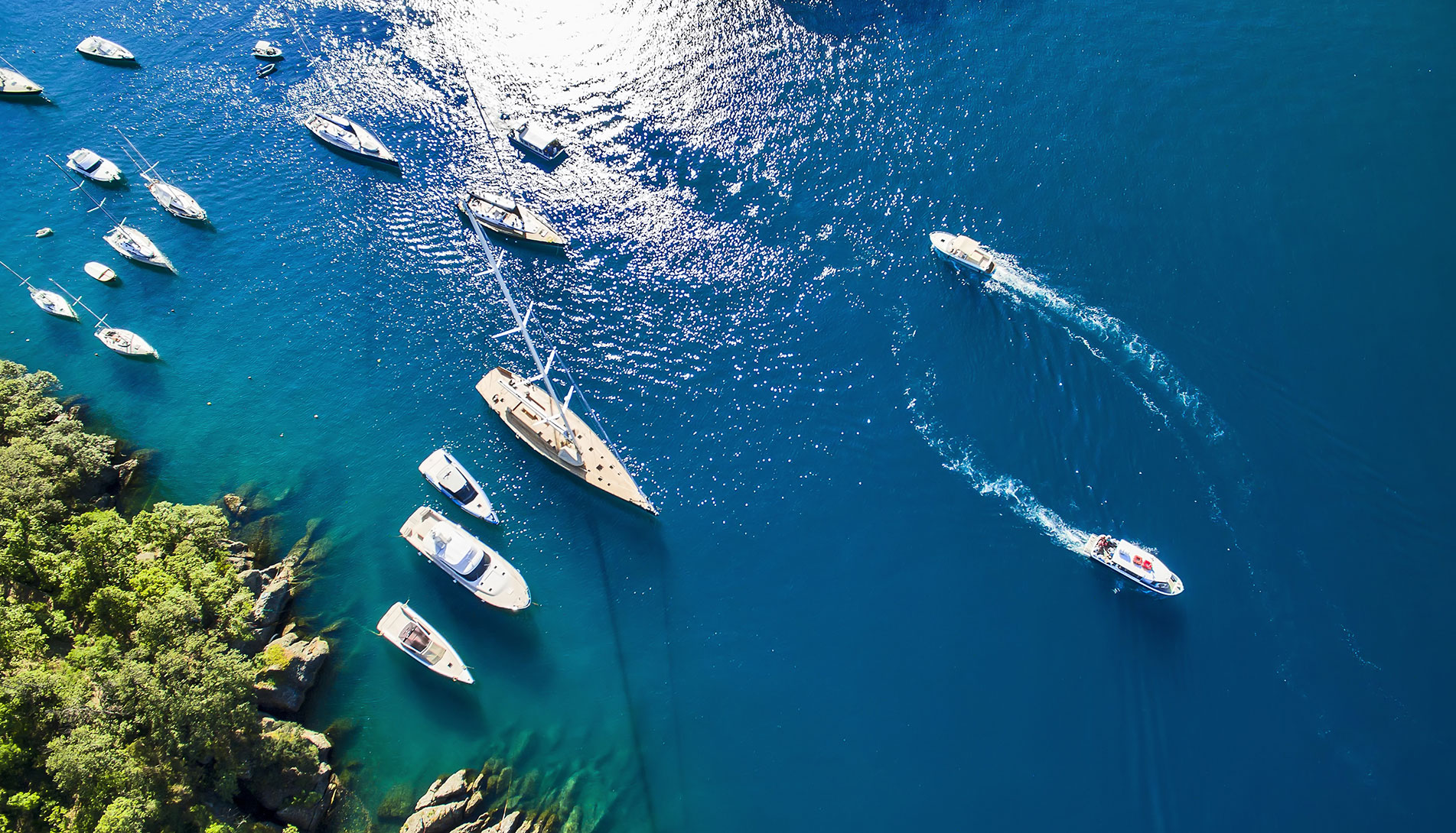 Sea with moving boats in the Portofino Natural Park